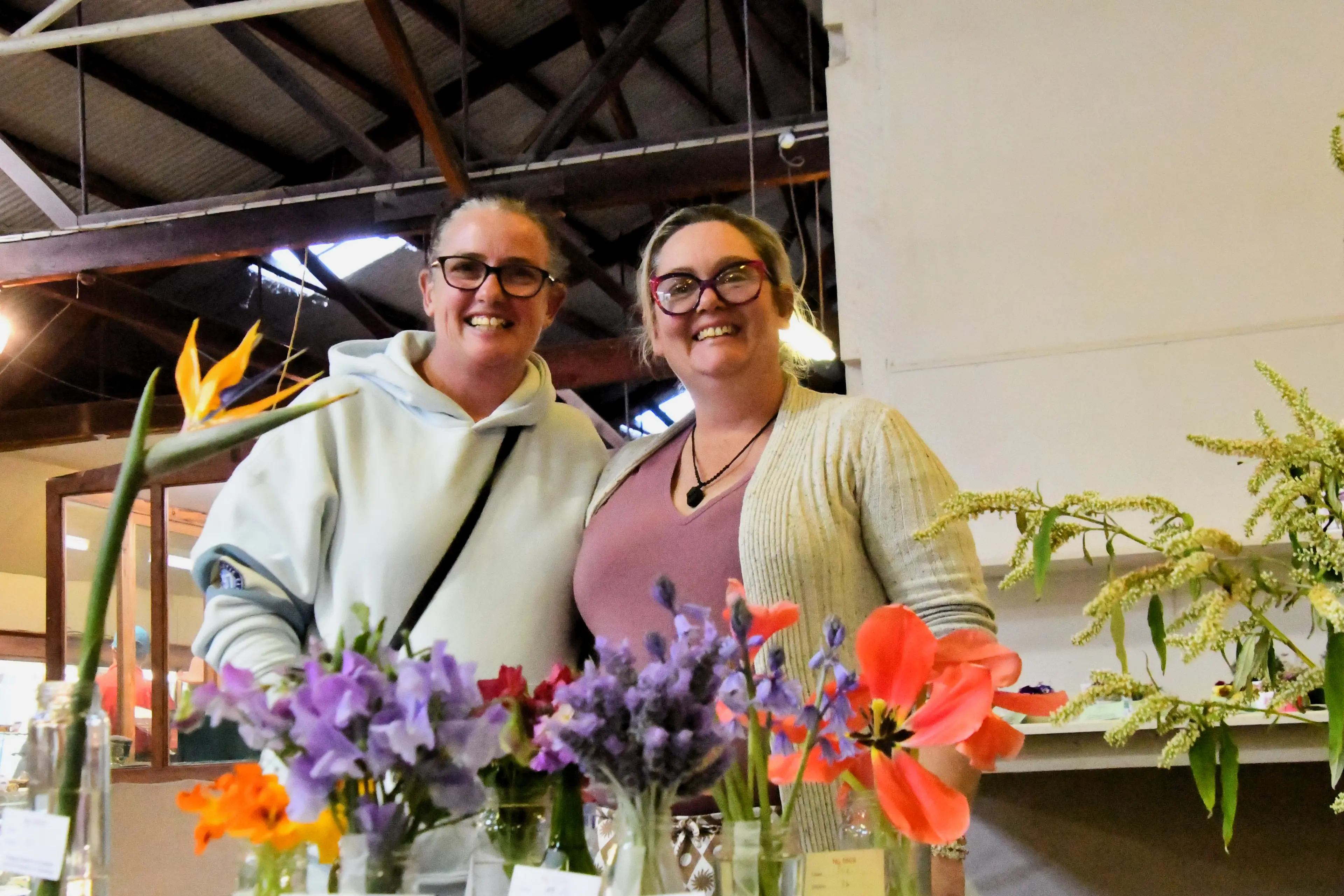 <p>Jacinda Acheson and Marlene Cuskelly admiring the flowers at the show in 2025.</p>\\n