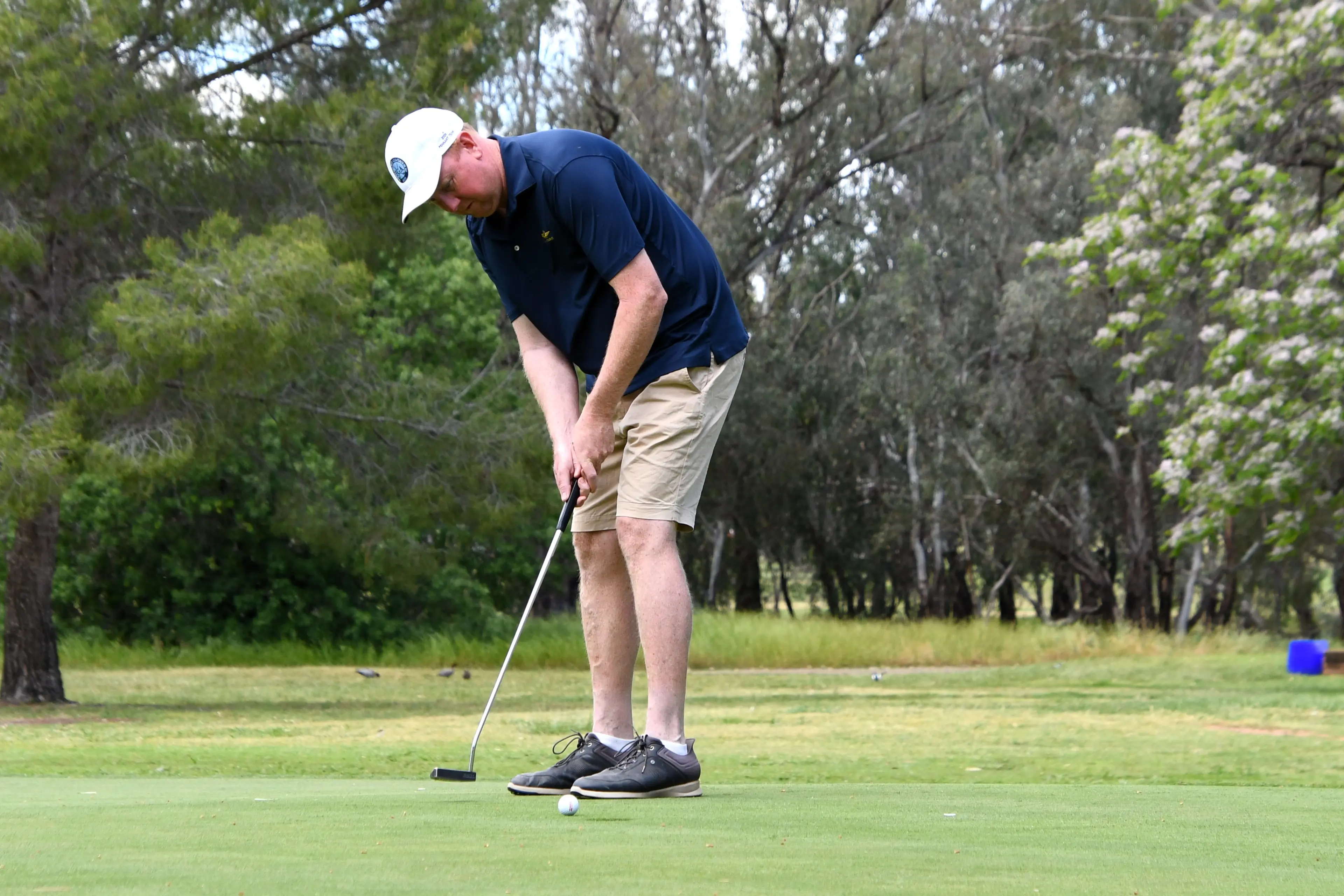 <p>John Betland putts in Saturday\\'s opening round.</p>\\n