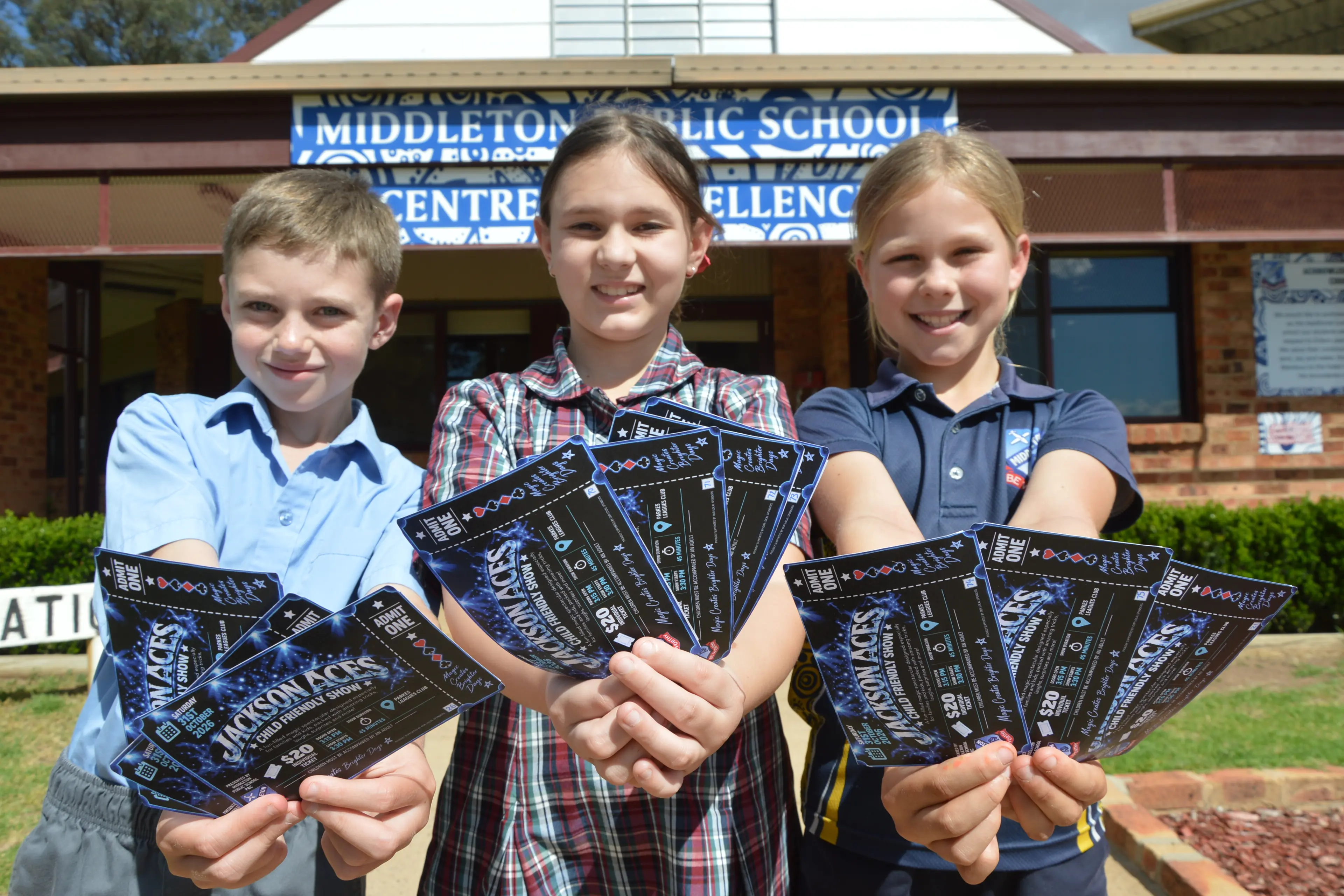 <p>Middleton Public School students Mason Compt, Macey Gaidzionis and Grace Wild with tickets to the world famous illusionist Jackson Aces\\' show in Parkes that will support their school. PHOTO: Christine Little</p>\\n