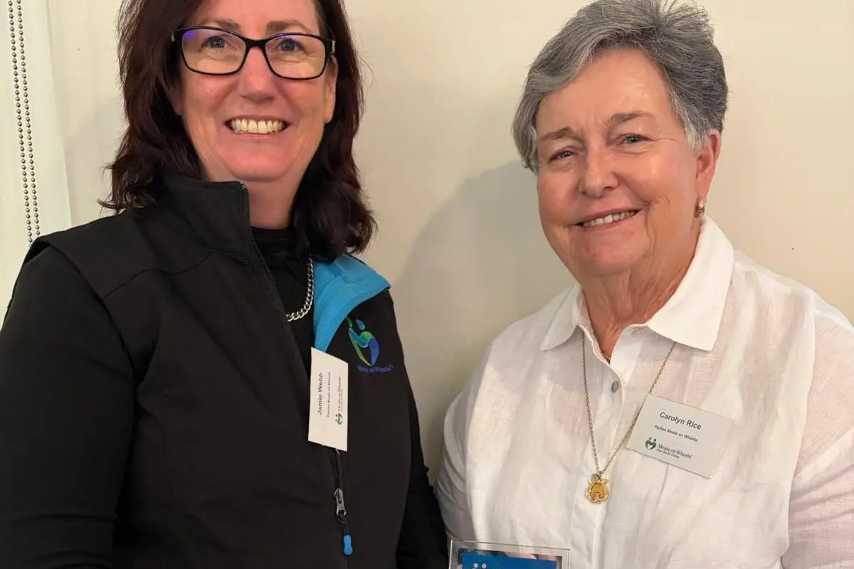 <p>Meals on Wheels Parkes and Forbes manager Jamie Webb accepts the Meals on Wheels NSW innovation award from Carolyn Rice.</p>\\n