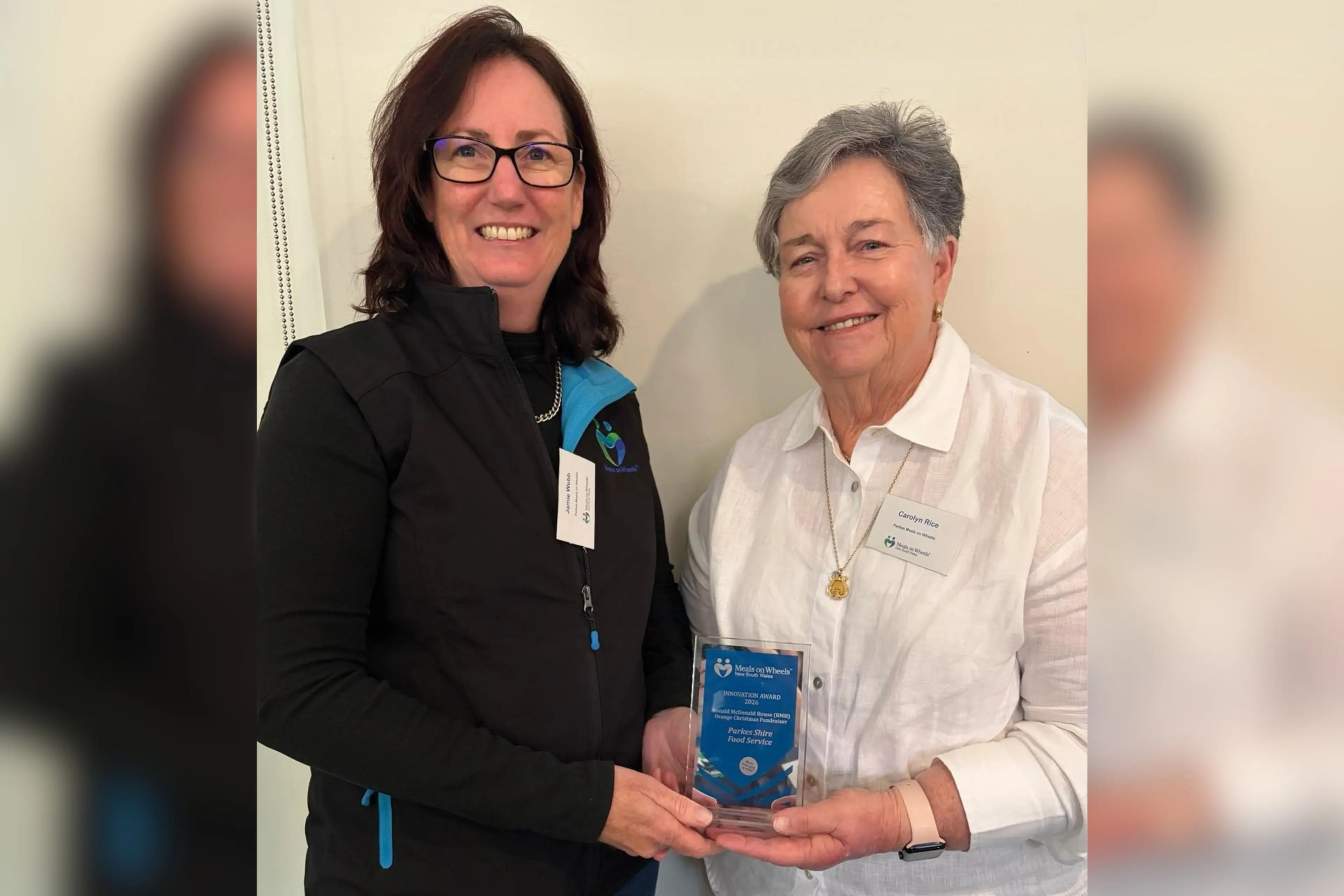 <p>Meals on Wheels Parkes and Forbes manager Jamie Webb accepts the Meals on Wheels NSW innovation award from Carolyn Rice.</p>\\n